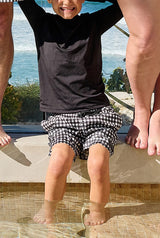 UNE PIECE Boys Swim Shorts in Black Gingham
