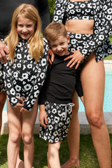 UNE PIECE Boys Swim Shorts in Daisy Silhouette Black